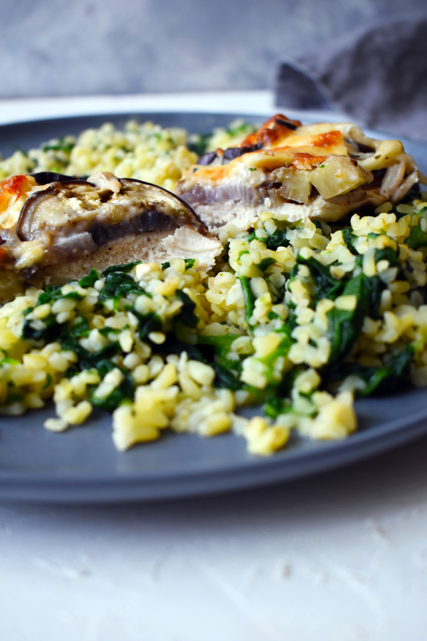 Chicken casserole with eggplant and cream cheese, served with spinach bulgur