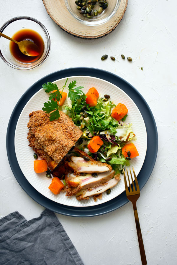 Breaded chicken breast with a gourmet salad and honey-orange dressing!
