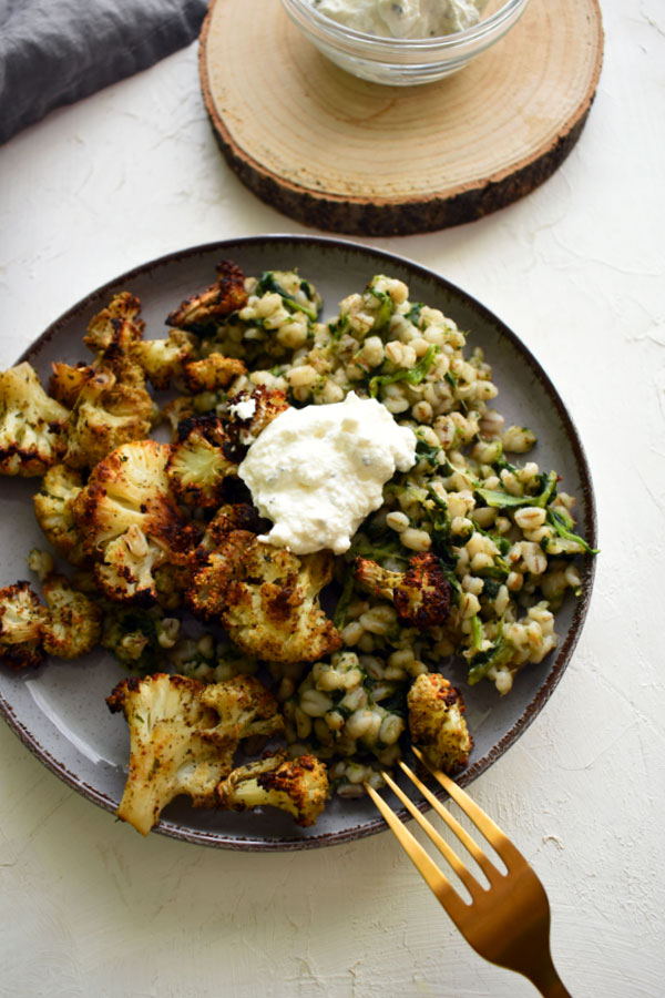 Roasted cauliflower with spinach barley and ricotta