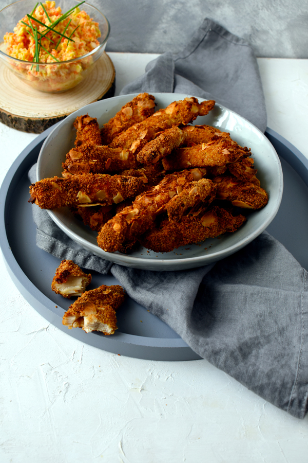 Oven-baked chicken breast strips in almond coating
